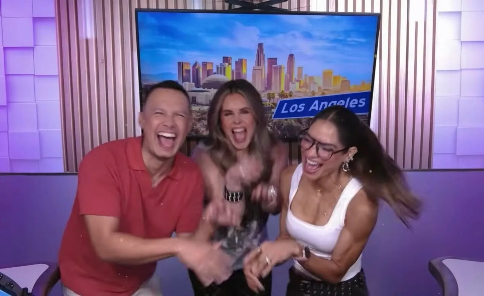 Luis Sandoval, Erika Reyna and Alejandra Espinoza laughing in the Buena Vibra studio in Los Angeles