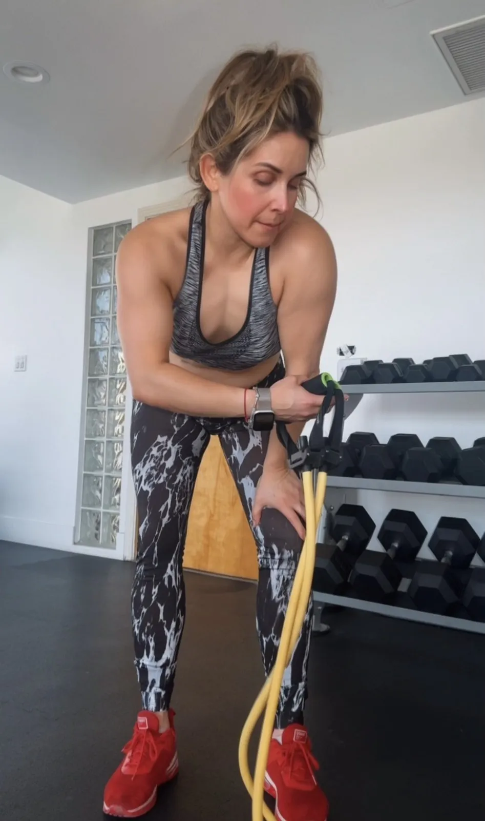 Erika Reyna working out with a resistance band